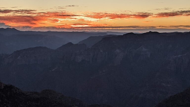 Brilliantly colored sunrise over a canyon