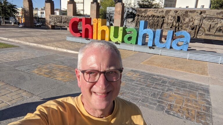 Lane standing in front of the letters spelling out CHIHUAHUA
