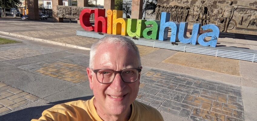 Lane standing in front of the letters spelling out CHIHUAHUA