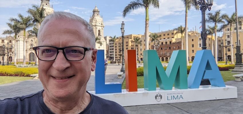 Lane standing in front ot the Lima sign in Plaza de Armas