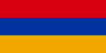A rectangular flag with a field of red across the top, blue across the middle, and gold across the bottom