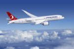 An airplane with the Turkish Airlines name and logo, flying above clouds